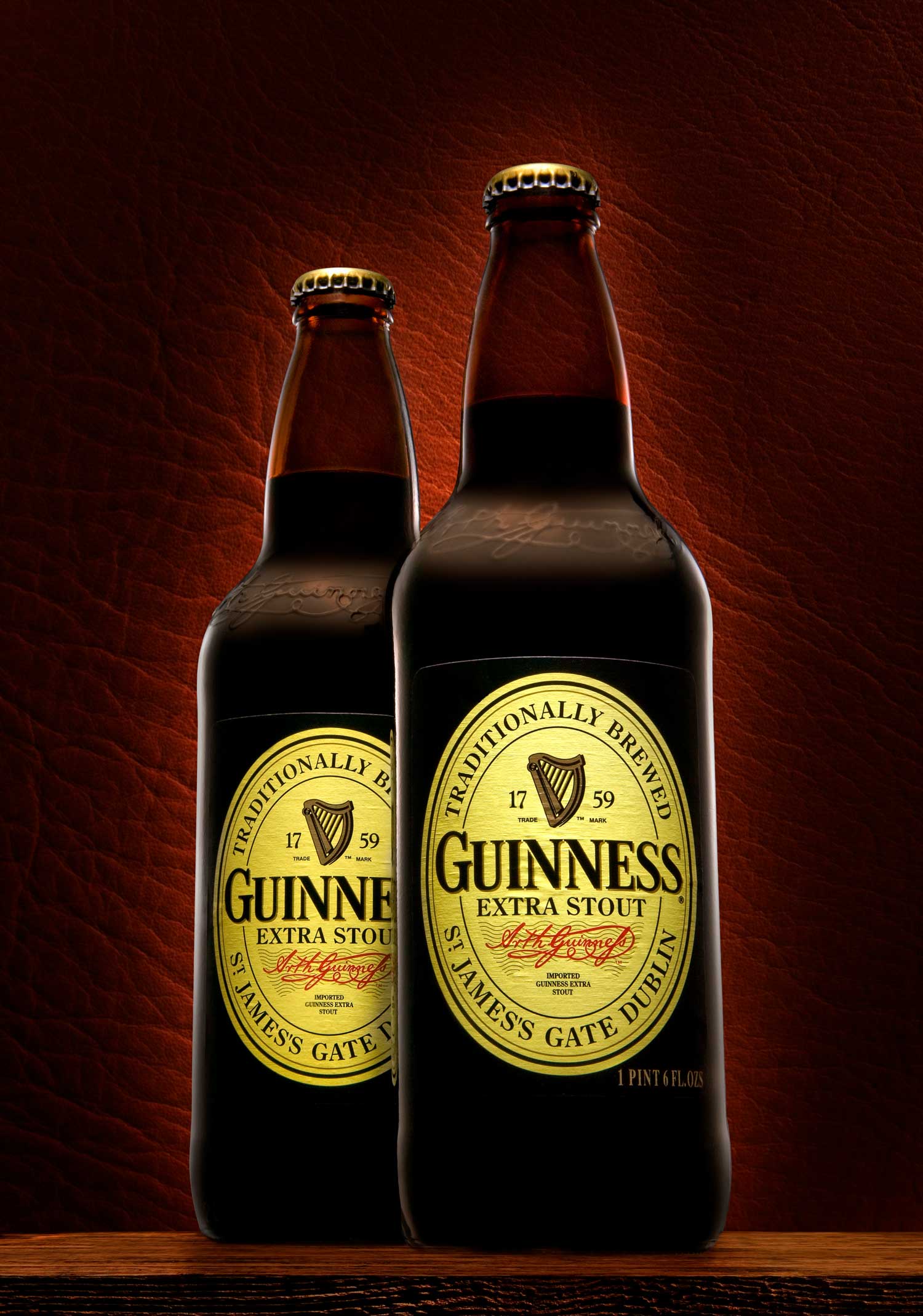 2 guinness bottles blurred background