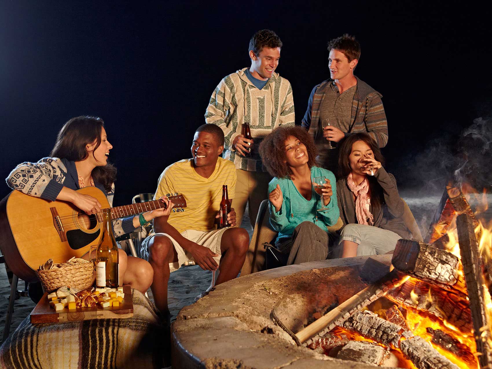 Photography_Children Teens_friends around a campfire-Tony Garcia
