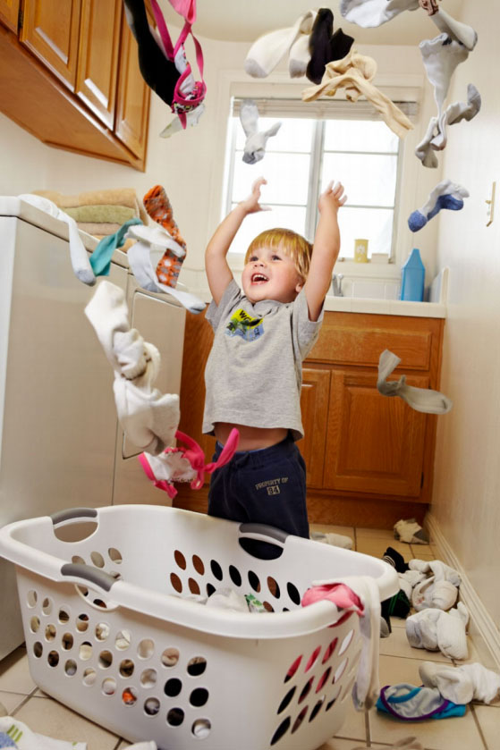 Photography_Children and Teens_Boy Menace Throwing Laundry-Tony Garcia