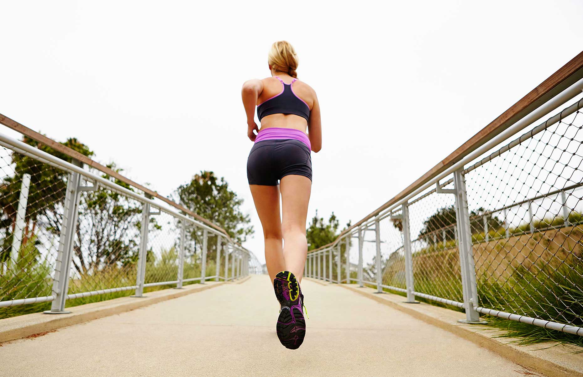 Photography_Sports and Fitness_Blond Woman Jogging on Walkway-Tony Garcia