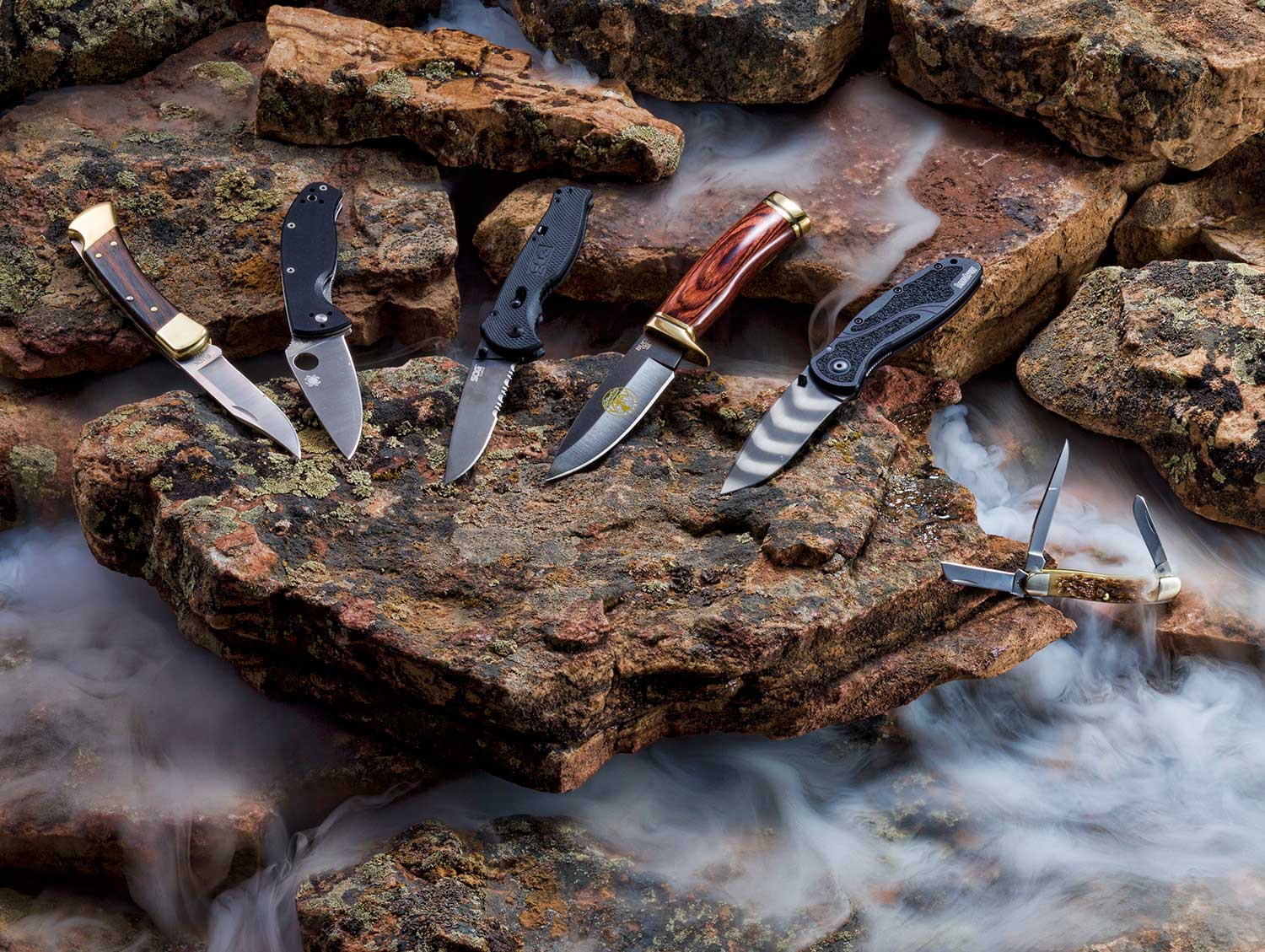 hunting knives still life on rocks