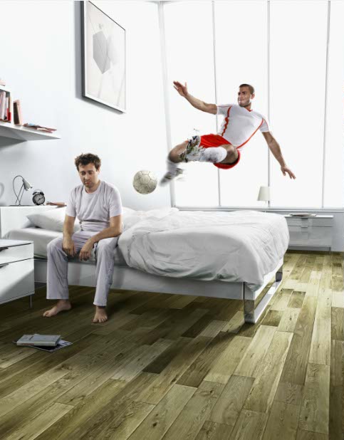 photo-imaging-man waking up in bed with soccer player kick 
